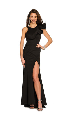 A woman poses elegantly in the Long Formal Dress 11311 by Dave and Johnny, featuring a black one-shoulder ruffle design and high slit, paired with silver heels and jewelry against a white background.
