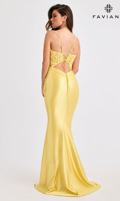 A woman wearing the Faviana 11400 long prom dress in yellow satin, featuring a lace corset bodice and lace-up back, stands against a plain background with the "FAVIAN" logo.