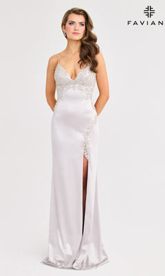 A woman wears the Faviana 11401, a floor-length silver satin prom dress with lace applique, spaghetti straps, strappy open back, and thigh-high slit, standing before a plain light background. "Faviana" logo in the top right.
