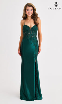 A woman wears the Faviana 11404 long prom dress in dark green satin, featuring lace details, a sweetheart neckline, corset bodice, high slit, and strappy open back, standing against a plain background.