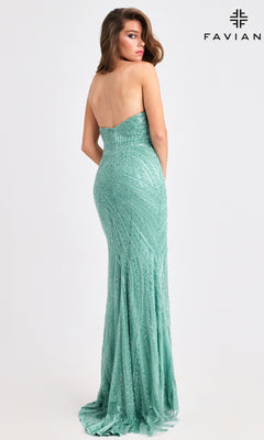 A woman faces away in the Faviana 11408 long prom dress—a strapless, mint green beaded gown with a fitted mermaid silhouette. The "FAVIAN" logo appears in the top right corner.