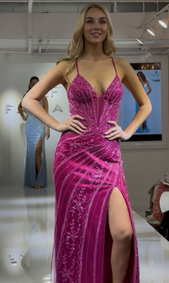 A woman models the Faviana 11409 long prom dress—a bright pink gown with beading, a sheer corset bodice, thin straps, and a thigh-high slit—while walking confidently down the runway.
