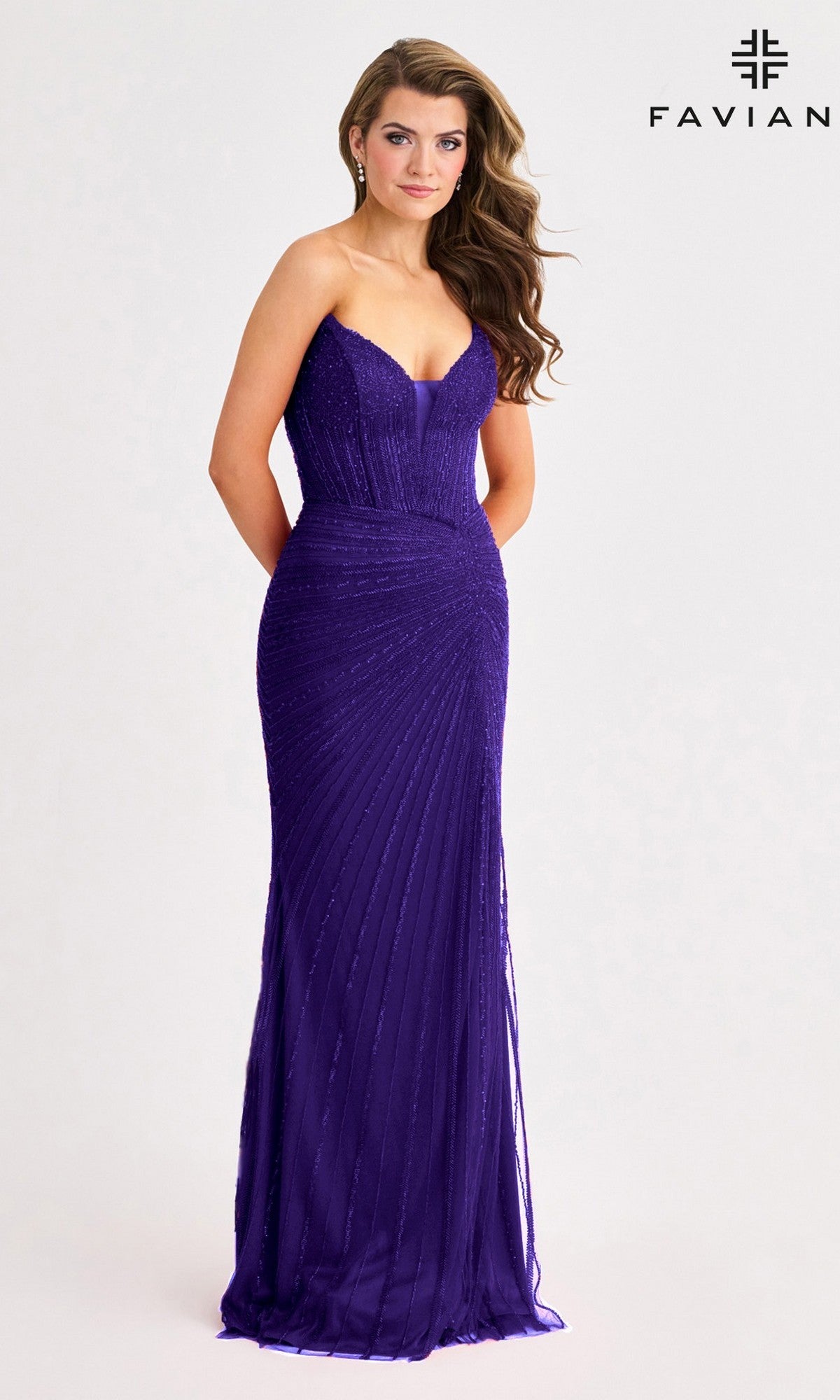 A woman poses in the Long Prom Dress: Faviana 11410, a strapless, fitted purple gown with beaded accents, against a plain light background featuring the Faviana logo in the top right corner.