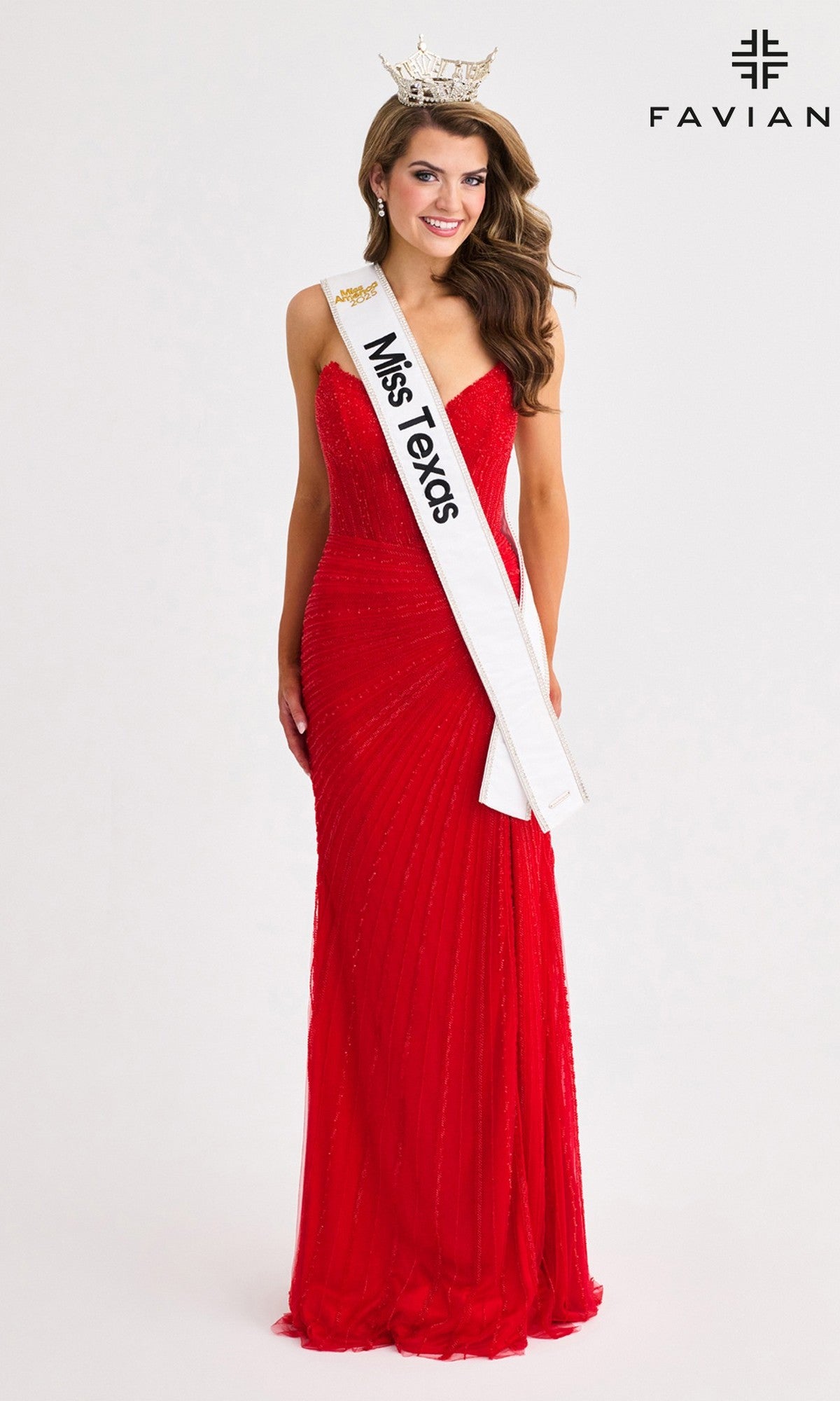 A woman wearing the elegant Faviana 11410 Long Prom Dress in red, along with a crown and 