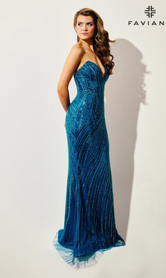 A woman poses in the Strapless Long Blue Sequin Prom Dress: Faviana 11411, featuring a fitted, sweetheart neckline and sparkling sequins, against a plain light background. "Faviana" appears in the top right corner, emphasizing this elegant formal look.