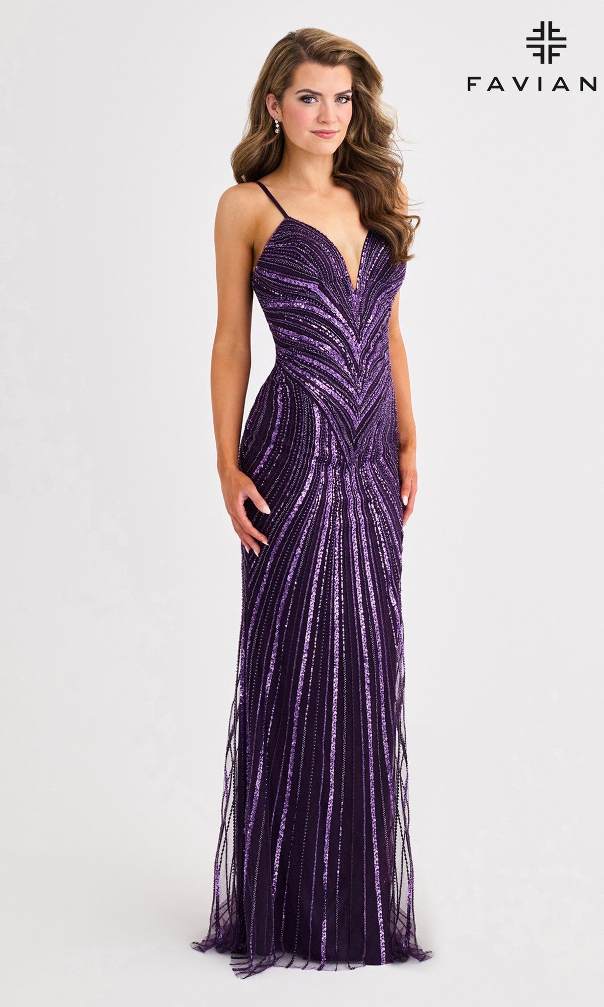 A woman poses against a white background in the Faviana 11412 long prom dress—sleeveless, floor-length, and purple with shimmering sequin patterns. The 