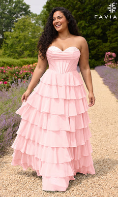 A smiling woman wears a light pink Faviana 11436E long plus-size prom dress featuring a strapless corset-style bodice and a tiered ruffled skirt.