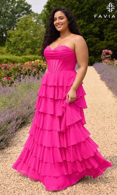 A plus-size person wearing a lipstick-colored Faviana 11436E, a strapless, floor-length ruffled chiffon dress with a corset bodice and a tiered skirt, standing on a gravel path in a garden.
