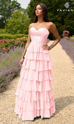 A woman stands on a garden path in the Strapless Long Ruffled Prom Gown: Faviana 11436, light pink with a fitted bodice. The FAVIAN logo appears in the upper right corner.