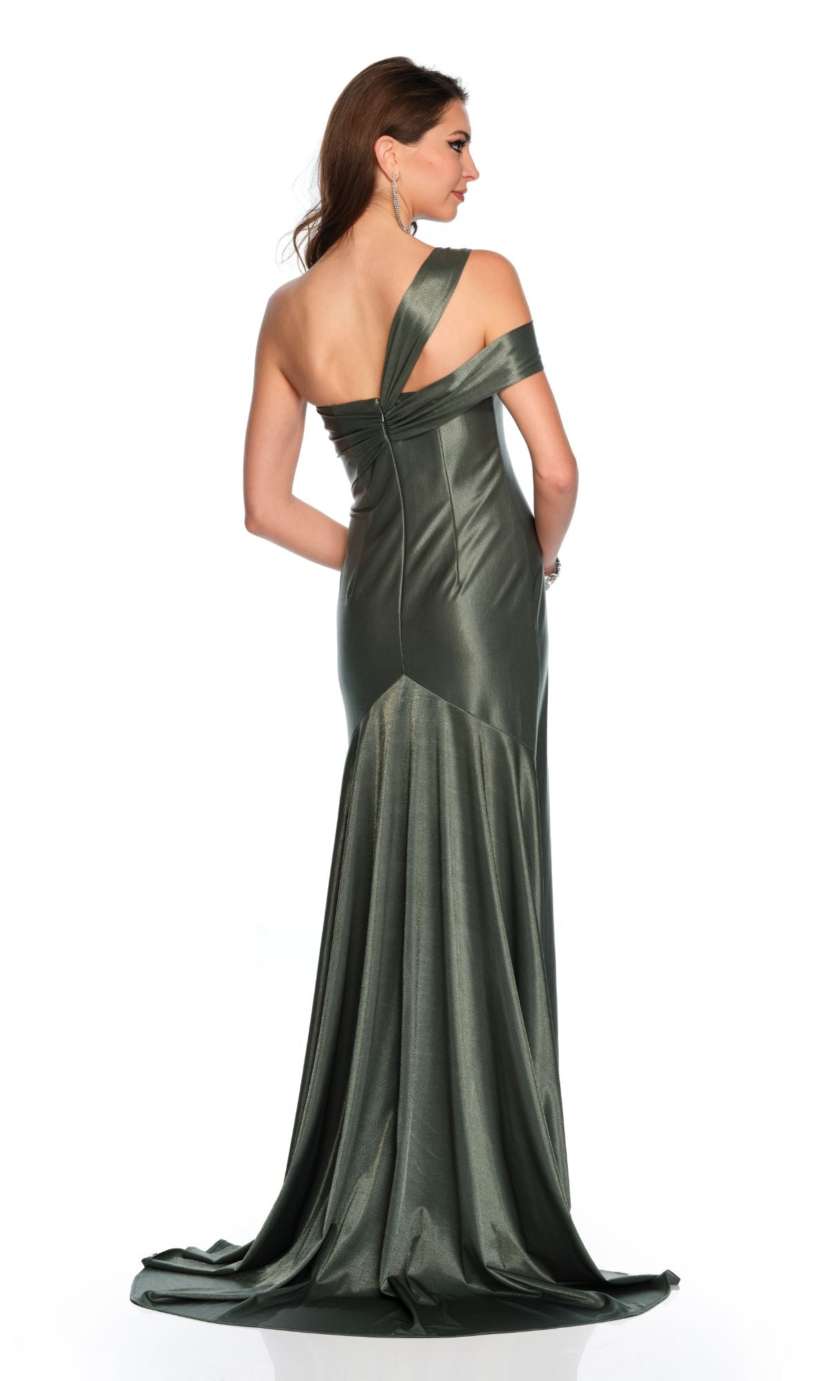 Woman wearing the Long Formal Dress 11486 by Dave and Johnny, a fitted metallic green gown with an asymmetrical one-shoulder design, standing with her back to the camera against a white background.