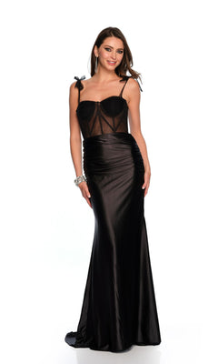 A woman stands and smiles, wearing the Long Formal Dress 11559 by Dave and Johnny—a black, fitted sleeveless dress with a sheer corset-style bodice, bow straps, lace-up back—with hoop earrings and a bracelet, against a white background.
