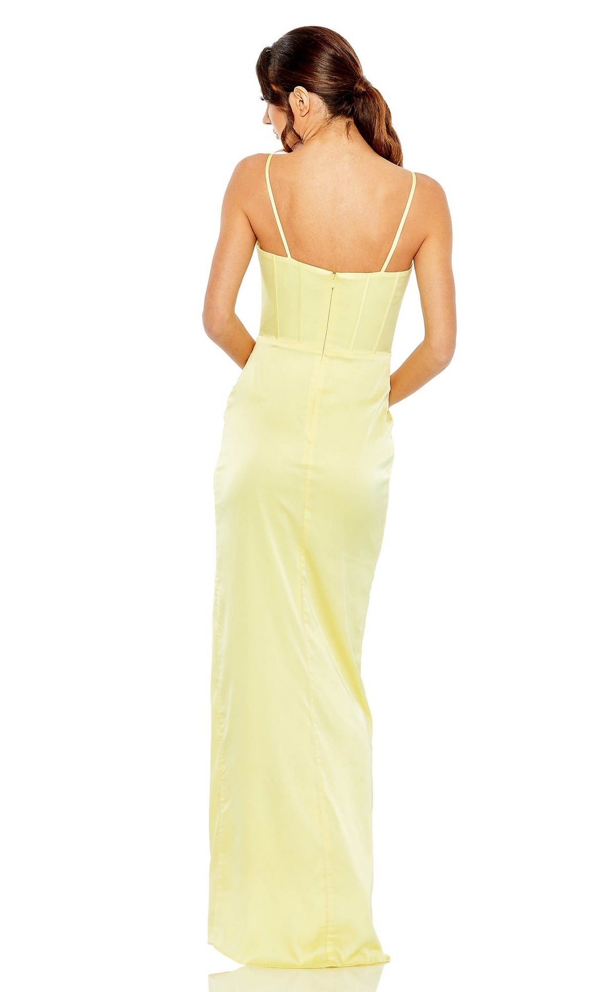 A woman faces away, wearing the Mac Duggal 11562 Long Bustier Prom Dress—light yellow, with thin shoulder straps and a fitted bodice.
