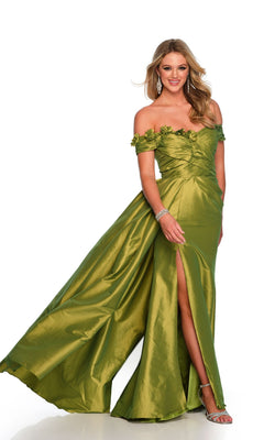 A woman wears the Long Formal Dress 11581 by Dave and Johnny featuring an off-the-shoulder, shiny green ruched bodice with floral details and a thigh-high slit, paired with silver heels and jewelry, against a white background.