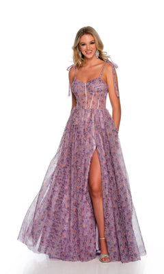 A woman wearing the Long Formal Dress 11591 by Dave and Johnny—floor-length, sleeveless, purple floral with sheer panels, sweetheart neckline, tied straps, thigh-high slit, and open lace-up back—stands against a white background.