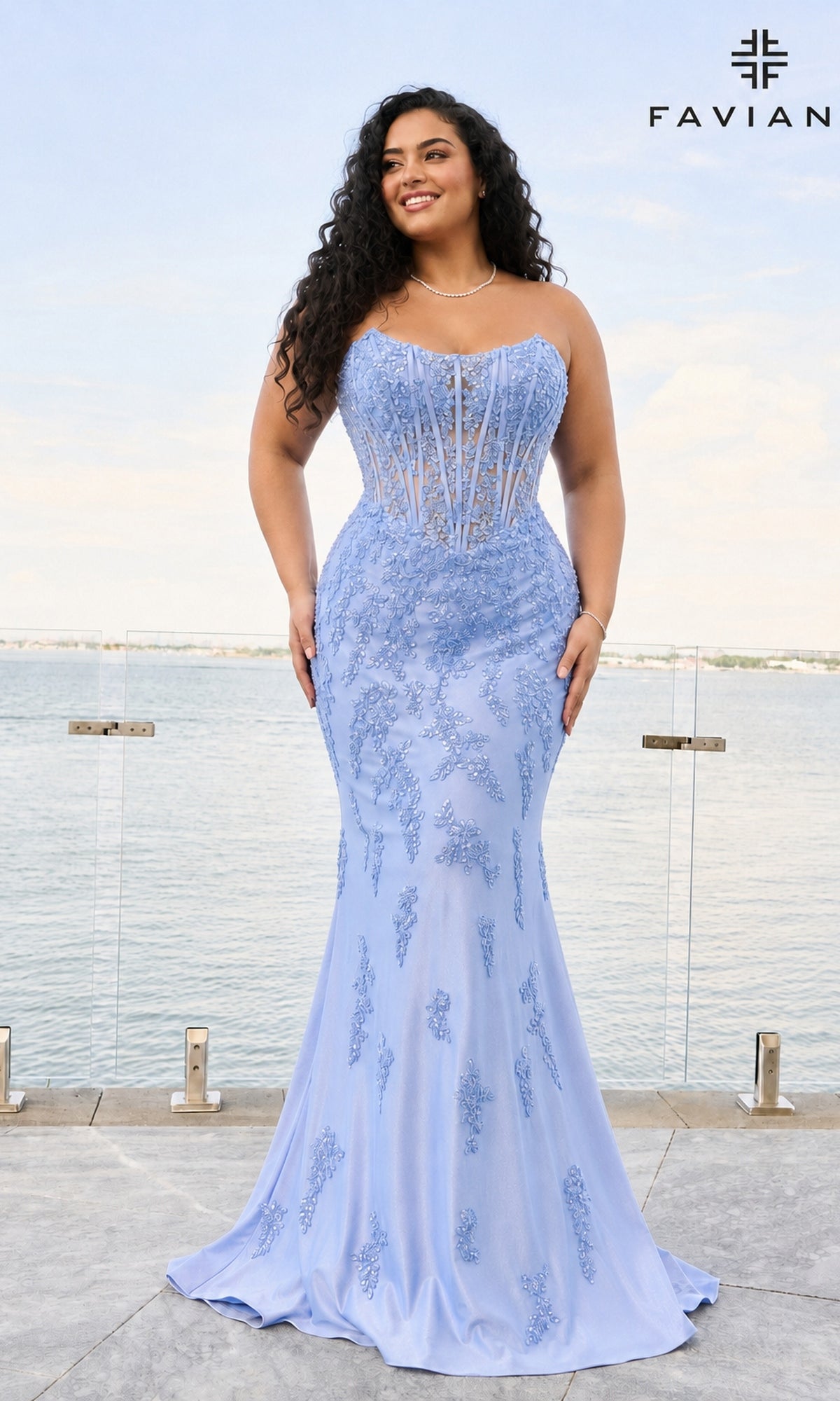 A person wearing a Long Plus-Size Prom Dress: Faviana 11600E, a cloud blue, strapless, floor-length corset gown featuring delicate floral embroidery.
