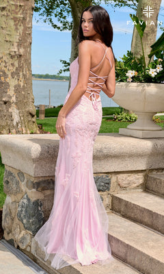 Long Prom Dress: Faviana 11601, a floor-length pink gown featuring a V-neck, a lace-up back, and floral appliqué detail.