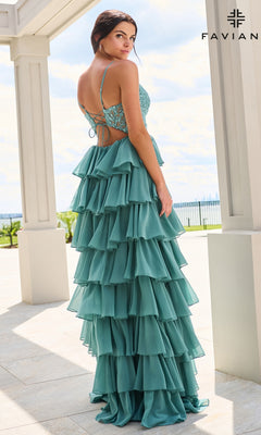 Faviana 11603 is a teal, floor-length prom dress featuring a corset bodice, lace-up back, and a tiered, chiffon ruffle skirt.