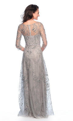 A woman is shown from behind wearing the Long Formal Dress 11606 by Dave and Johnny, a silver A-line gown with sheer, embroidered sleeves and back, set against a white background.