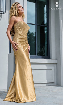 A woman in a gold Faviana 11613 strapless corset prom dress with a bodice featuring scattered rhinestone embellishments.