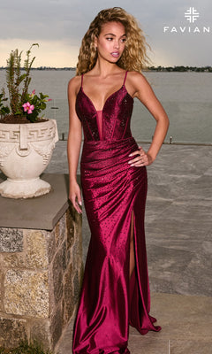 A person wears a burgundy satin Long Prom Dress: Faviana 11621 featuring a plunging V-neckline, spaghetti straps, and a floor-length skirt with a high slit and subtle embellishments.