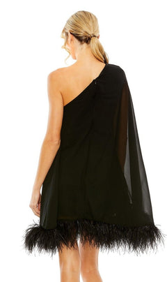 A blonde woman with a ponytail models the Mac Duggal 11623 one-shoulder short wedding guest dress, highlighted by a chic feather-trimmed hem, shown elegantly from the back.