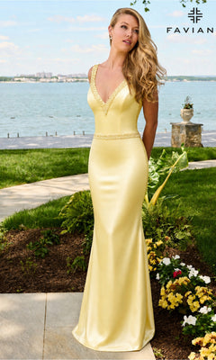 A woman wearing a lemon yellow Long Prom Dress: Faviana 11630, featuring a floor-length satin silhouette, a deep V-neckline, and intricate trim detailing along the straps and waist.