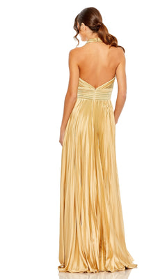 A woman in the Mac Duggal Long Formal Dress 11636—gold, pleated, floor-length with a chic v-neck halter style—is shown from the back, her hair in a ponytail.