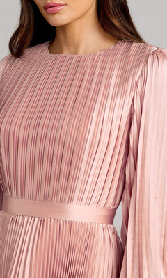 Woman wearing the Mac Duggal 11638 Fuchsia Midi Wedding Guest Dress, featuring pleats, long sleeves, a round neckline, and a matching waistband.