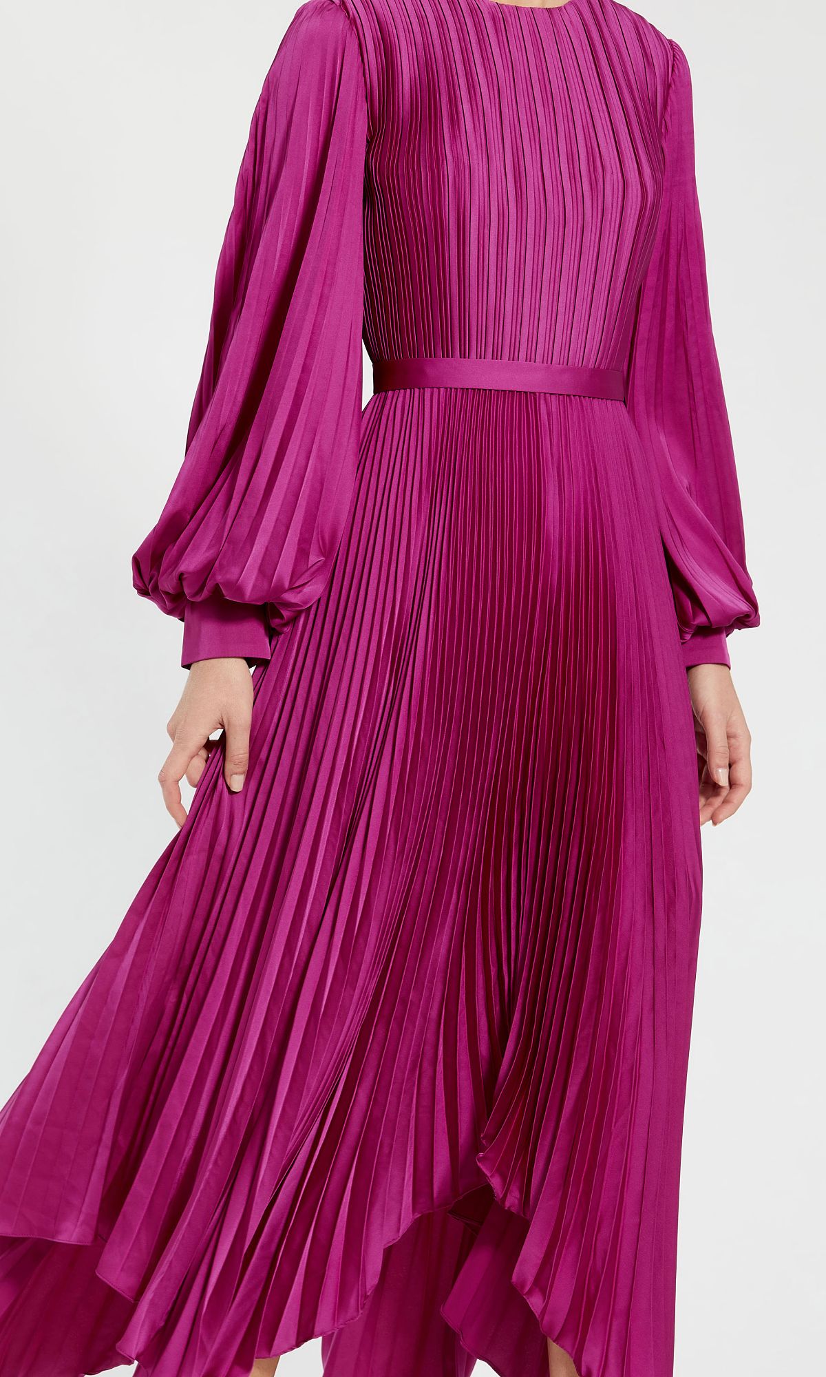 A person wears the Fuchsia Midi Wedding Guest Dress: Mac Duggal 11638, a long sleeve, pleated midi dress with a fitted waist and full skirt, photographed from shoulders to mid-calf against a plain background.