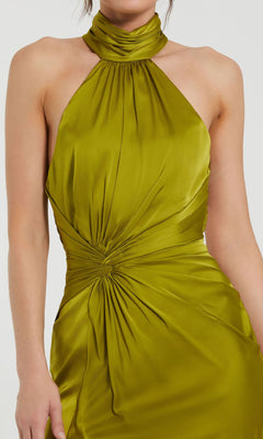 Person wearing the Mac Duggal 11642 High-Neck Long Prom Dress, a sleeveless, lime green satin gown with a gathered neckline and ruched waist detailing.