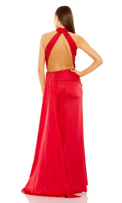 A woman stands facing away from the camera, modeling the High-Neck Long Prom Dress: Mac Duggal 11642, a red evening gown with a backless design against a white background.