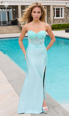 A woman wearing a light blue strapless Faviana 11644 prom dress with a lace bodice and a side slit, standing by a swimming pool.
