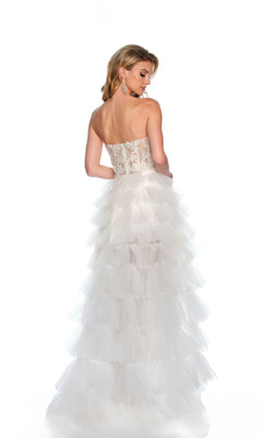 A woman models the Long Formal Dress 11651 by Dave and Johnny, featuring a strapless lace corset bodice and ruffle layered tulle skirt, shown from the back against a white background.