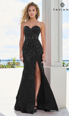 A woman wearing the black Faviana 11654 long prom dress, featuring a strapless sweetheart neckline, beaded floral detailing, a floor-length silhouette, and a thigh-high slit.
