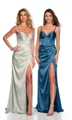 Two women wear Dave & Johnny Long Prom Dress 11657—floor-length, sleeveless gowns with thigh-high slits. One is light silver with a boned bodice; the other is blue. Both accessorize with heels and statement earrings.