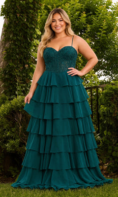 A person wearing a Long Plus-Size Prom Dress: Faviana 11665E in dark hunter green, featuring a lace corset bodice and a floor-length, tiered ruffled skirt.