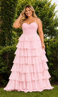 A woman wearing the light pink Faviana 11665E Long Plus-Size Prom Dress, featuring a floor-length lace corset gown with a sweetheart neckline and a tiered, chiffon ruffle skirt.