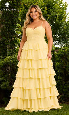 A plus-size person wearing a light yellow lace corset gown with a tiered ruffled skirt, the Faviana 11665E long plus-size prom dress.