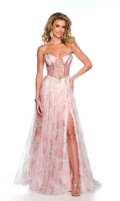 A woman models the Dave & Johnny Long Prom Dress 11670, featuring a strapless pastel pink design with a sheer corset bodice and high slit, posed against a plain white background.