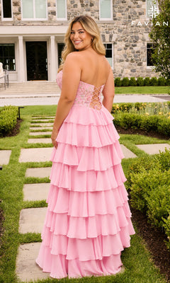 Faviana 11675E is a light pink, strapless plus-size prom dress with a tiered ruffle skirt and a lace-up corset back.