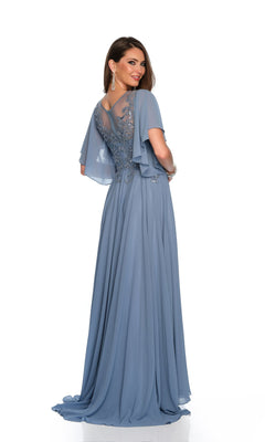 A woman models the Dave & Johnny Long Prom Dress 11676, a floor-length light blue gown with a sheer embroidered back and flutter sleeves, set against a white background.