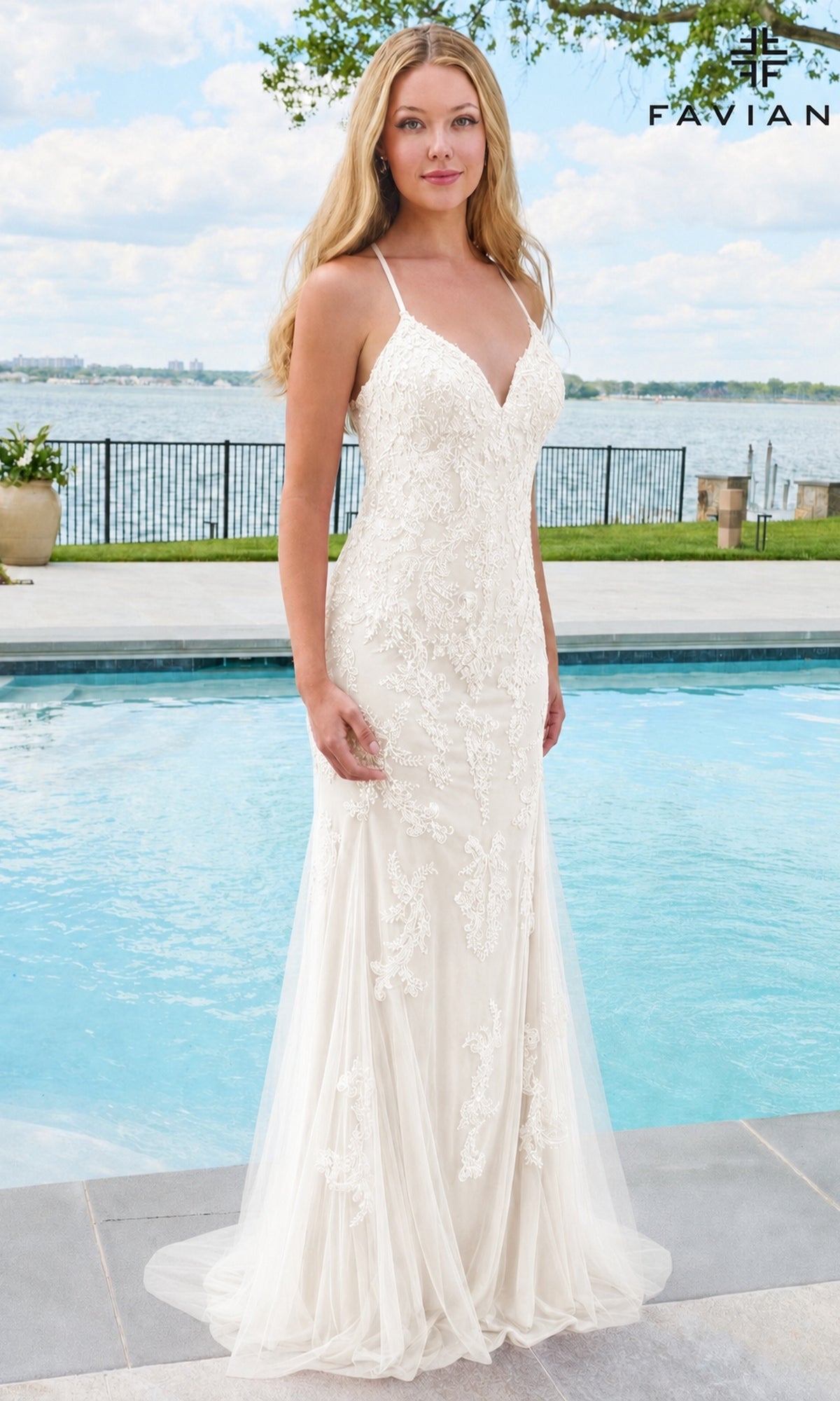 Ivory Faviana 11678 floor-length prom dress with a V-neck, spaghetti straps, and beaded lace appliques, standing by a swimming pool.
