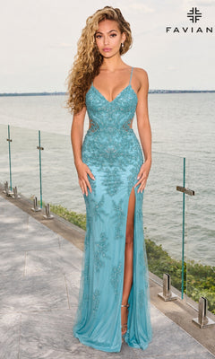 A woman wearing a dark Pacific blue Faviana 11679 long prom dress with lace detailing, waist cutouts, and a high leg slit stands on a balcony overlooking the water.