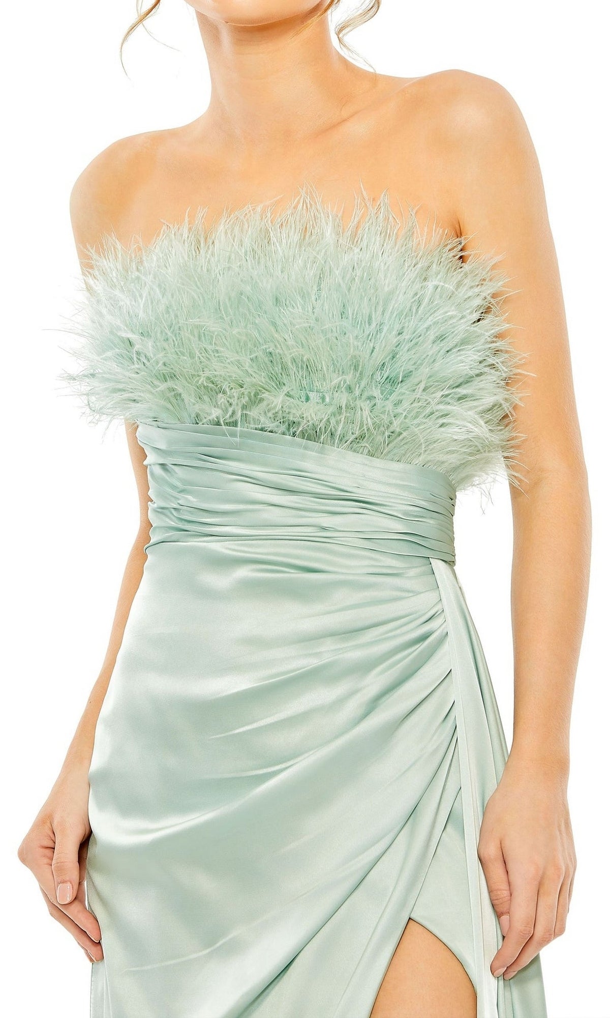 A woman wears the Long Formal Dress 11690 by Mac Duggal, a seafoam green satin strapless gown with a feathered bodice and bold thigh-high slit.