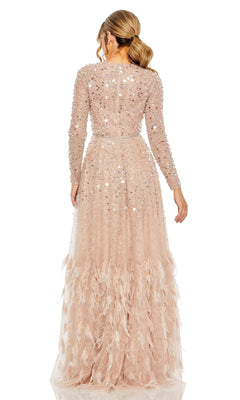 A ponytailed woman is seen from the back wearing the Mac Duggal 11782 long sleeve sequin formal gown, featuring floor-length design and feather details.