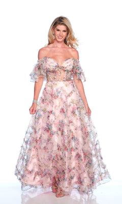 A woman poses elegantly against a white background, wearing the Dave & Johnny 11784 Pink Floral Prom Dress with an off-the-shoulder design, ruffled sleeves, fitted bodice, and delicate pink floral pattern.