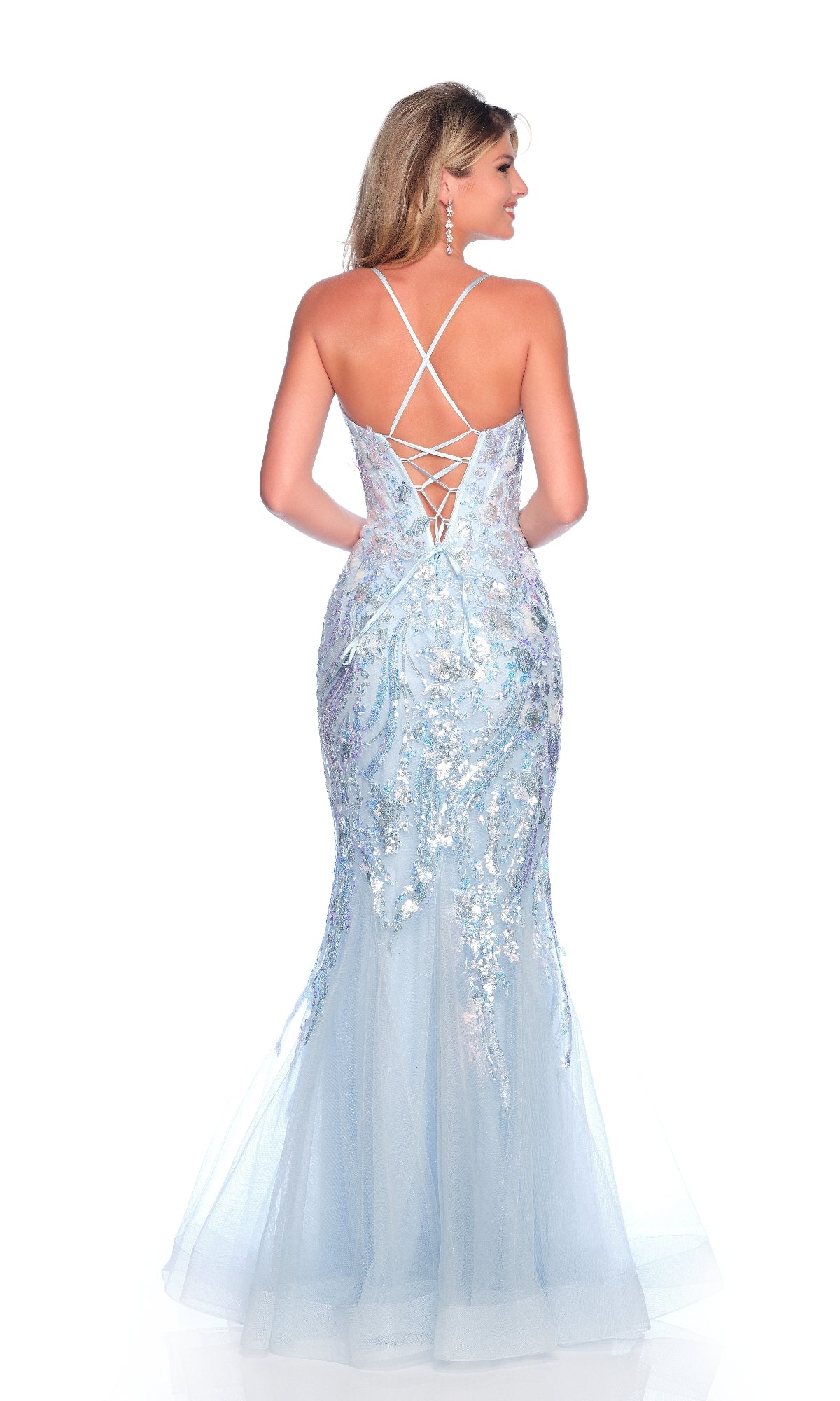 A woman wearing the Dave & Johnny 11804 light blue mermaid prom dress with sequin details and a lace-up back stands facing away from the camera.