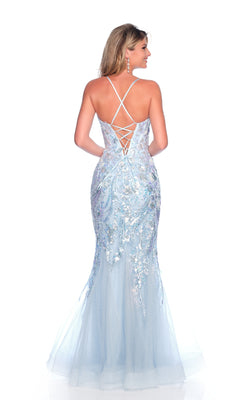 A woman wearing the Dave & Johnny 11804 light blue mermaid prom dress with sequin details and a lace-up back stands facing away from the camera.