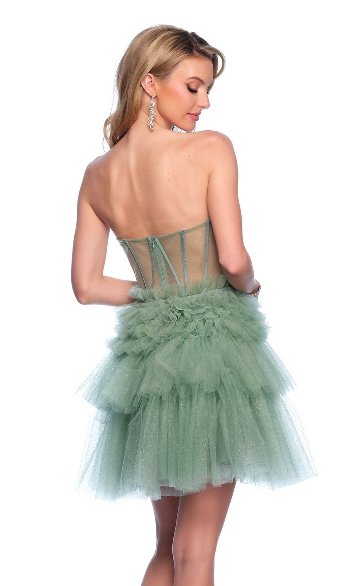A woman wearing the Dave & Johnny Short Green Ruffle Hoco Dress 11826, featuring a strapless corset-style bodice and tiered tulle skirt, faces away while looking over her shoulder.