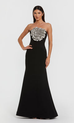 Black strapless evening gown with floral embellishment on a white background